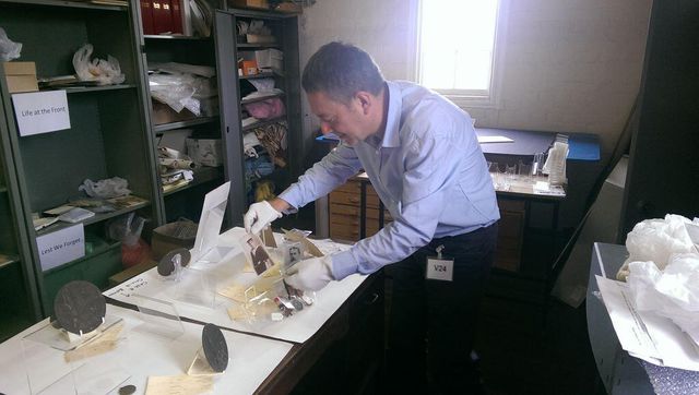 Dr Brad Beaven preparing artefacts for displa