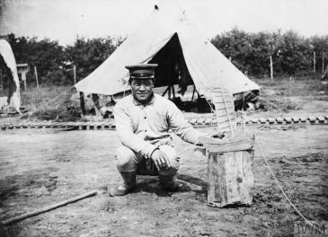 A Chinese worker with a model junk at the Chinese Labour Corps Camp at Caestre, 14 July 1917’