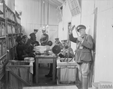 Image: Soldiers of the Army Service Corps preparing films for use in behind-the-lines cinemas for the troops. Boulogne, 5 June 1918 © IWM (Q 8885)