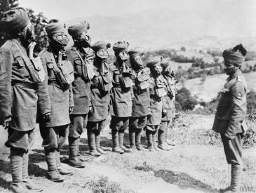 Indian troops at gas mask drill. © IWM (Q 56644)