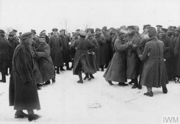 German and Bolshevik soldiers dancing with each other in the area of the Yaselda River at the time of the peace negotiations at Brest-Litovsk, February 1918. © IWM (Q 86975)