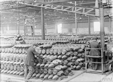 Belgian workers in the bond store of the National Projectile Factory at Birtley-Elisabethville, Co. Durham, 1918. © IWM (Q 27737)