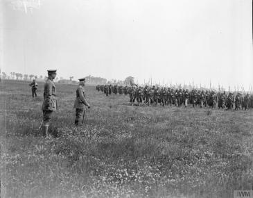 Belgian troops marching past King Albert I of the Belgians at Houthem, 2 July 1918. © IWM (Q 9017)