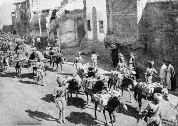 An Indian Army transport section moves along 'New Street' Baghdad during the entry of British forces into the city on 11 March 1917 © IWM (Q 24196).jpg